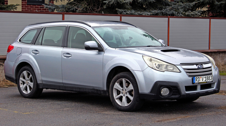Silver 2013 Subaru Outbook on the street