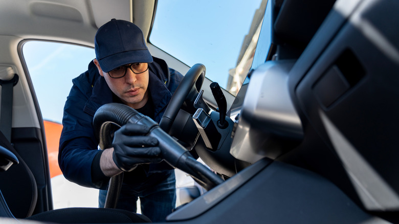 Guy with hat detailing car