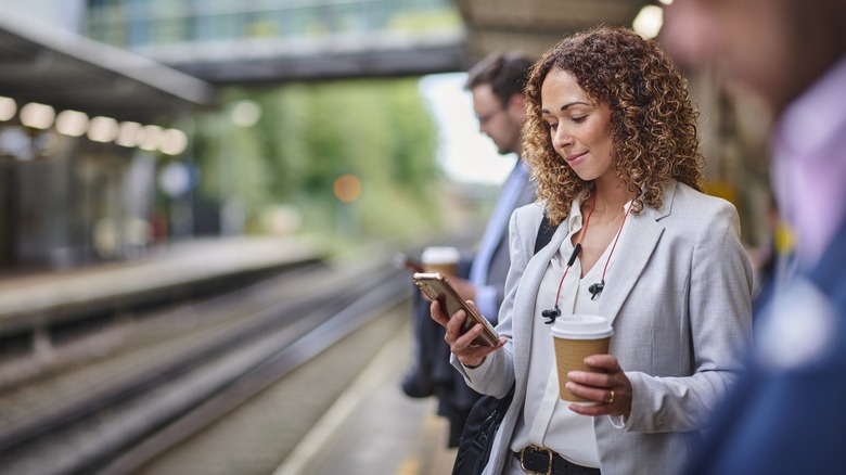 Woman using a phone outdoors