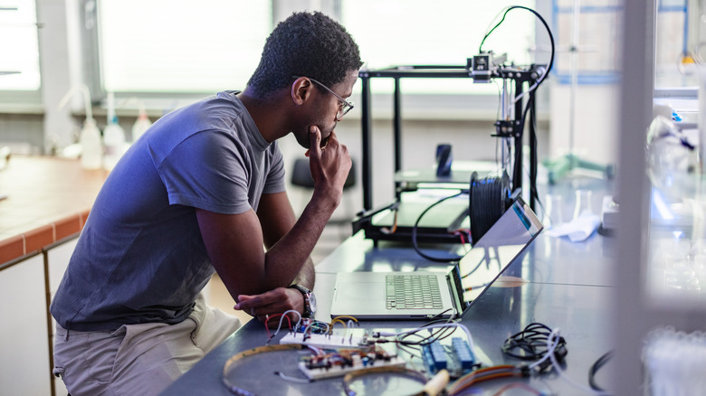 Person working with 3D printer