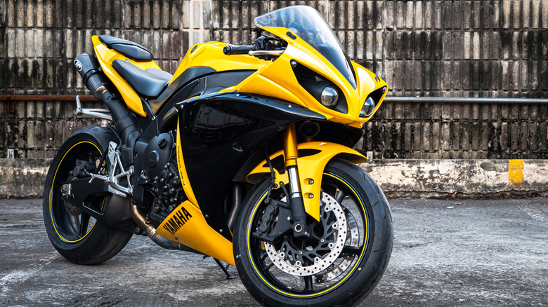 Bright yellow Yamaha R1 parked on the street