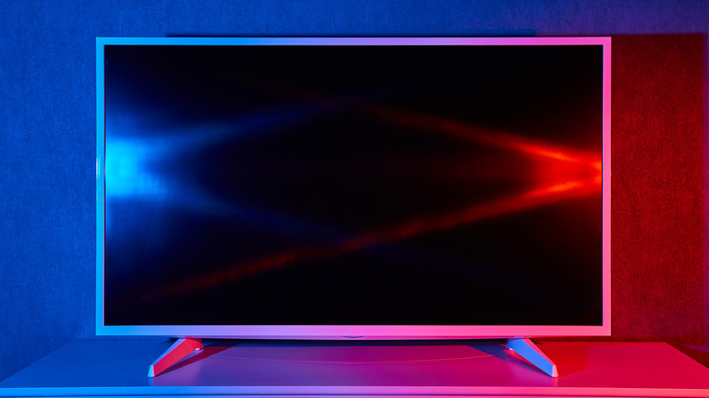 An LED television with blue and red accent lights on either side