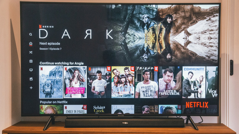 Netflix interface on an OLED TV in a daylit room