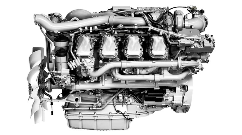 A gorgeous silver Scania DC16 engine, left profile visible against a white background