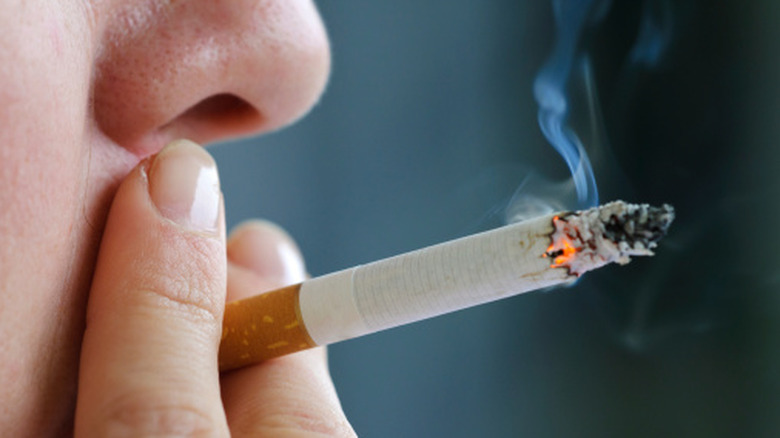 Close-up of a person smoking a cigarette