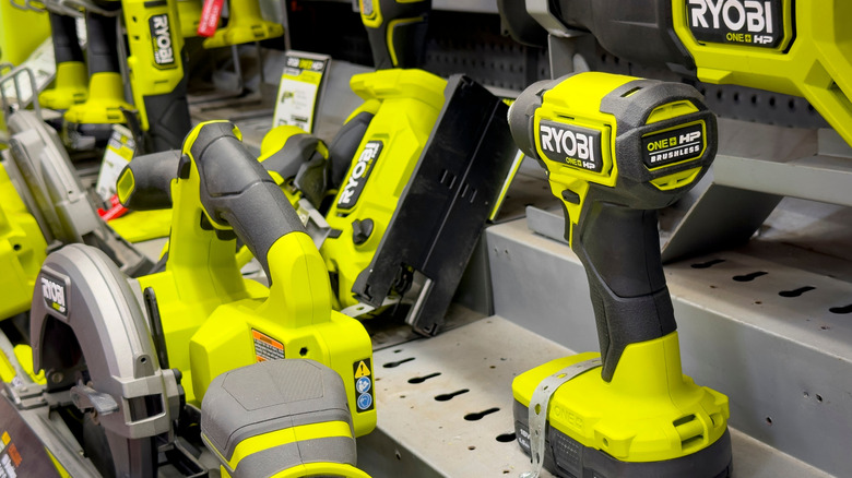 Several Ryobi power tools in a store