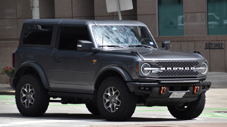 Front 3/4 view of Ford Bronco two-door in urban setting