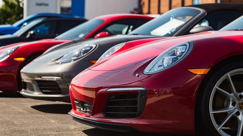 Porsches parked in row