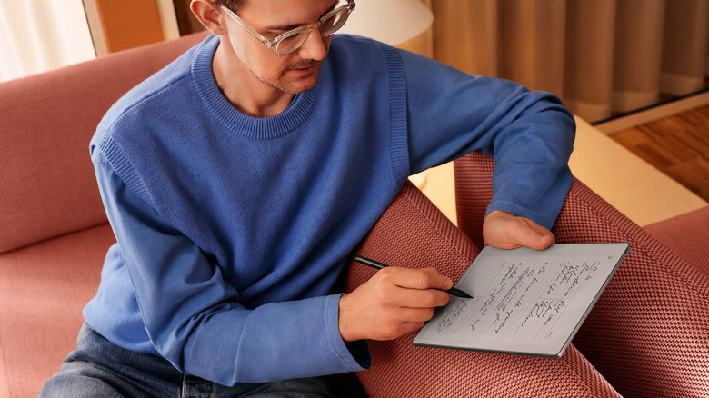 A man using a reMarkable Paper Pure to take notes