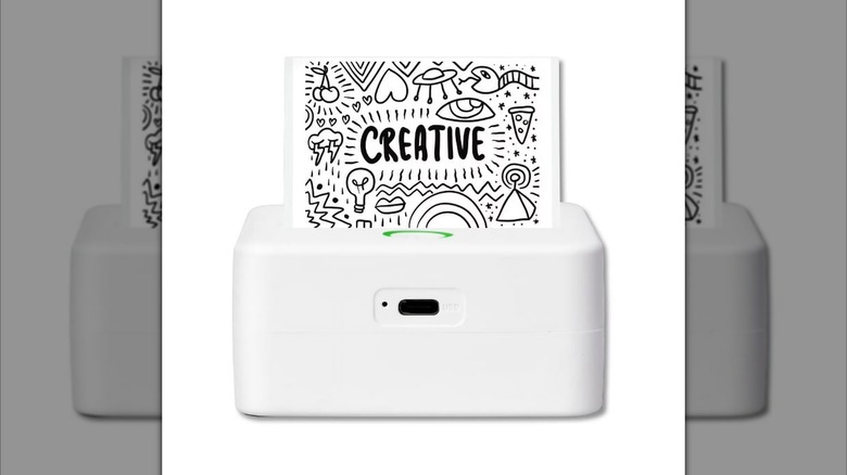 A CTP500 thermal printer showing a label saying Creative.