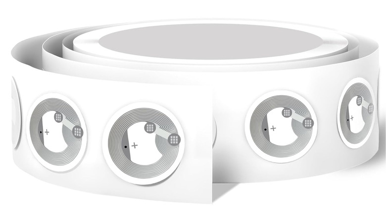 A roll of NFC stickers is shown onscreen