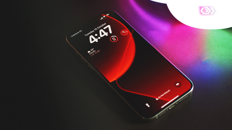 iPhone next to a glowing pair of headphones