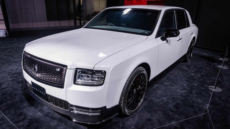 White Century Sedan GRMN on display at a car show