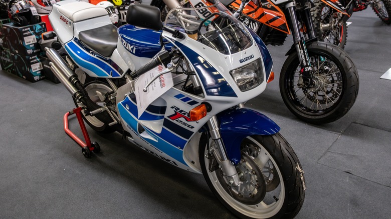 A parked Suzuki RGV250 at a motorcycle show
