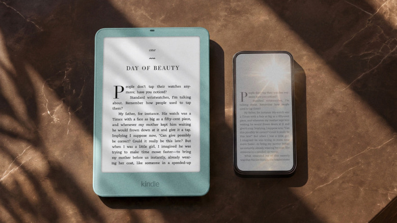 Amazon Kindle Paperwhite next to a smartphone