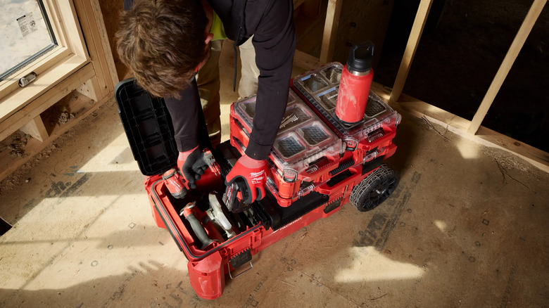 Milwaukee rolling tool chest with compact split lid on job site