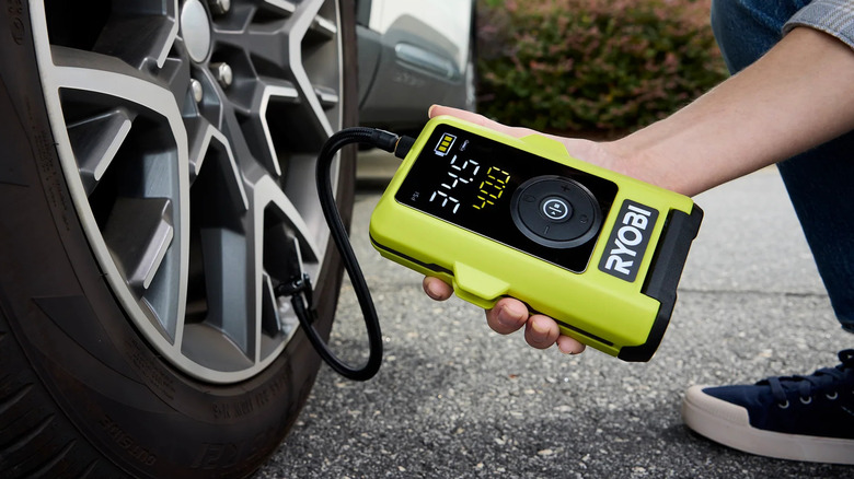 Ryobi USB Lithium smart tire inflator (FVIF52K) inflating a tire