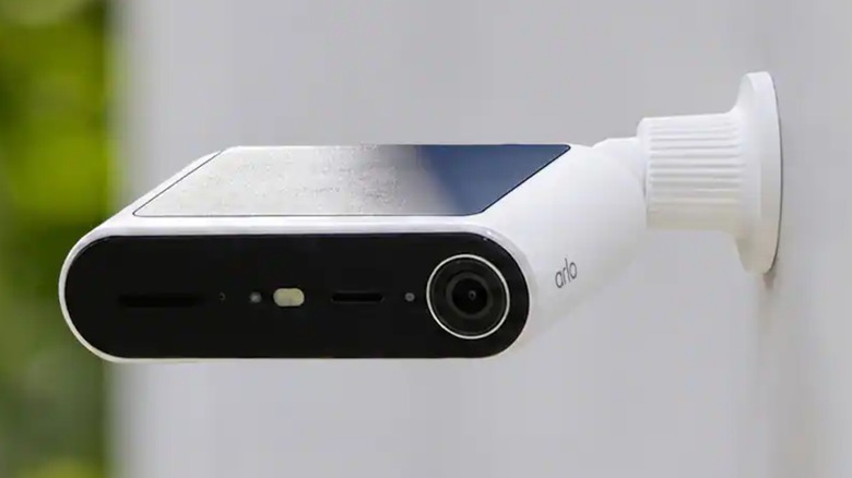 The Arlo Essential Solar Security Camera mounted to an outdoor wall