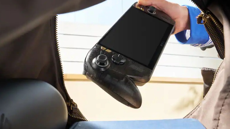 A person pulling the ROG XBOX Ally X20 OLED Gaming Handheld out of a bag