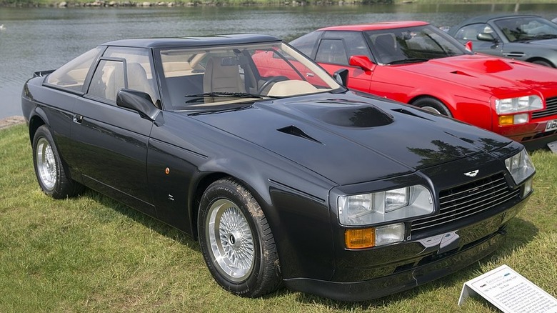 Two Aston Martin V8 Zagatos at car show.