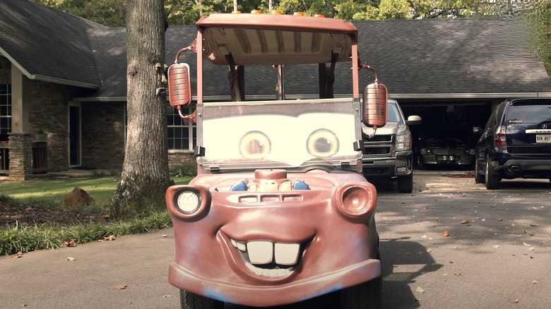 Tow Mater golf cart parked in a driveway