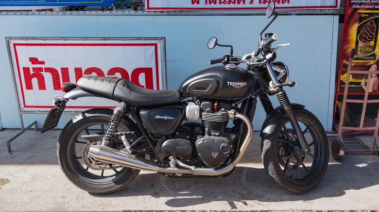 Black motorcycle brand Triumph Steed 400CC at Damnoen Saduak Floating Market