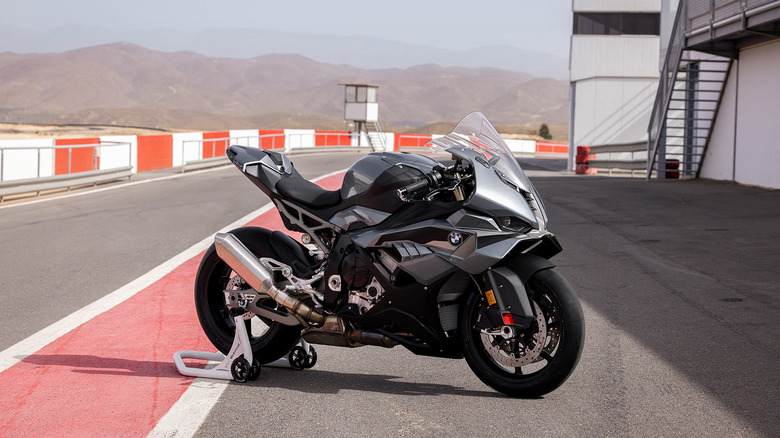 A gray 2025 BMW S 1000 RR parked at a racetrack