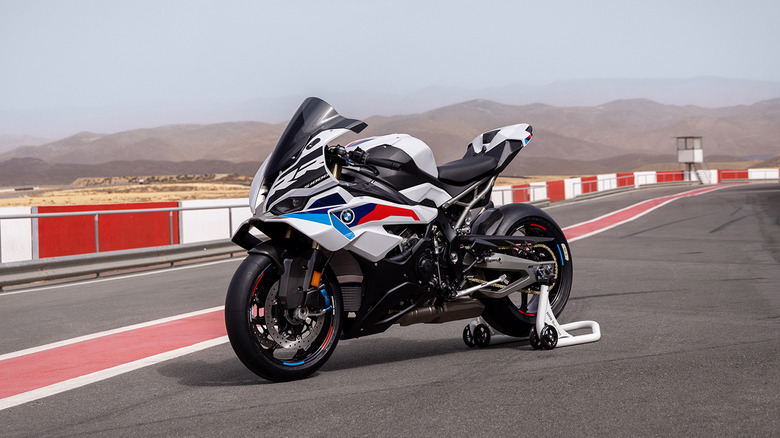 A white 2025 BMW S 1000 RR parked at a racetrack