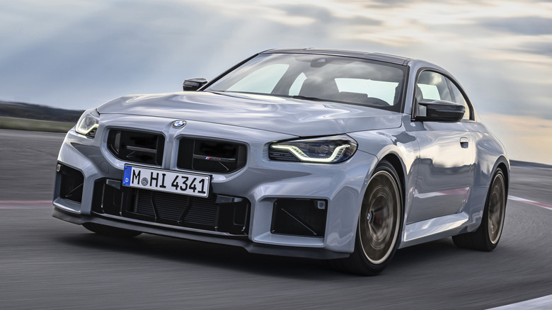 A gray BMW M2 CS being driven on a track.