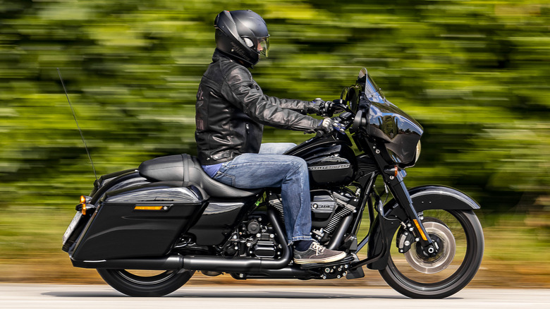 harley street glide special racing past greenery