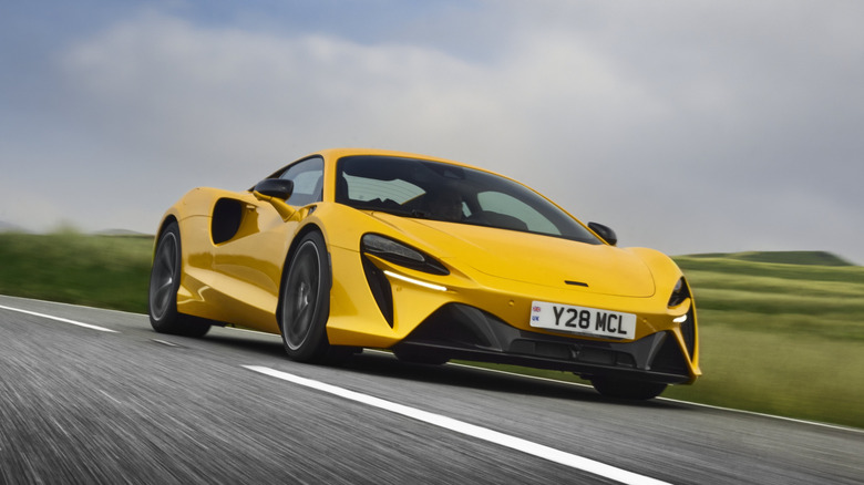 Yellow McLaren Artura front 3/4 view dynamic image