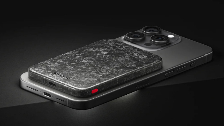 iPhone with the Sharge CarbonMag power bank attached