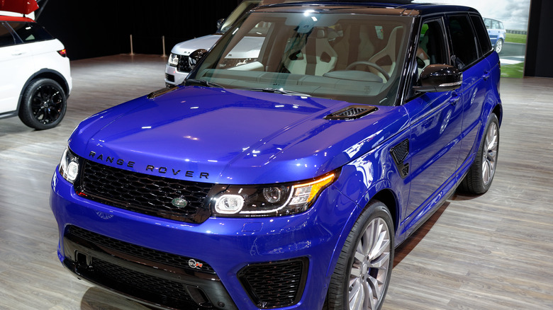 blue 2015 Range Rover Sport SVR on display at an auto show