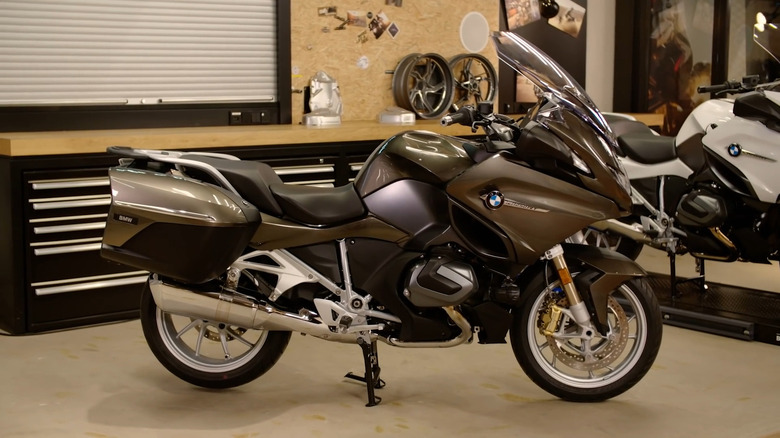 A BMW R 1250 RT parked in a showroom