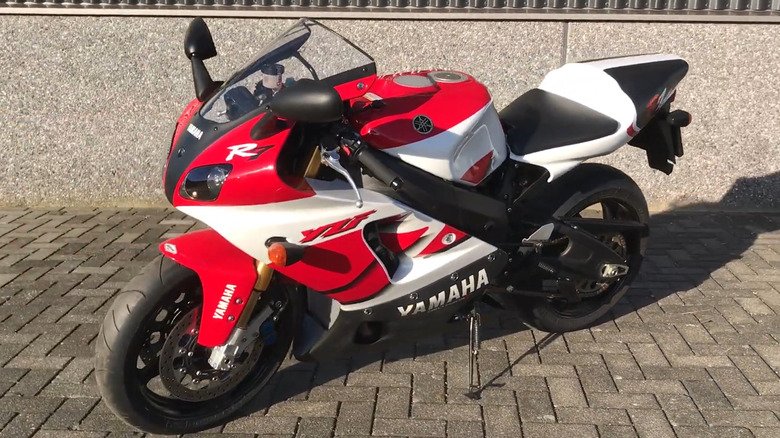 A1999 Yamaha YZF-R7 OW-02 bike standing in a parking space