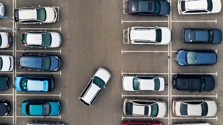 Various cars in a parking lot