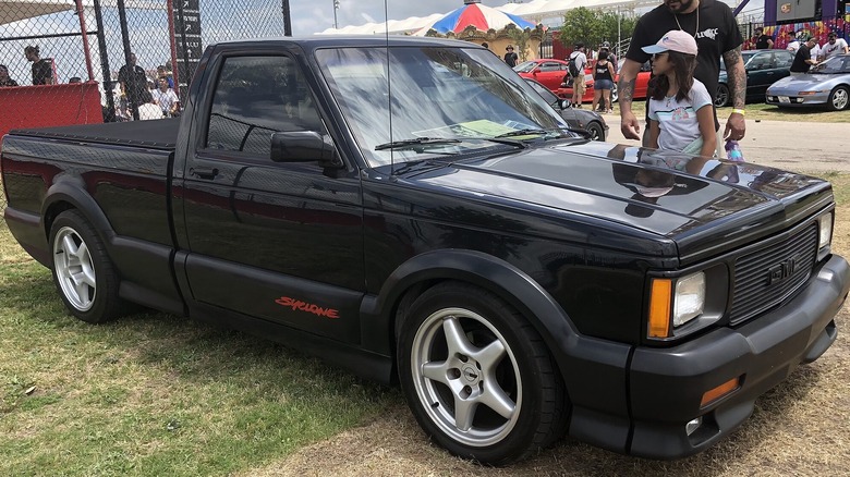 A GMC Syclone truck at a car event