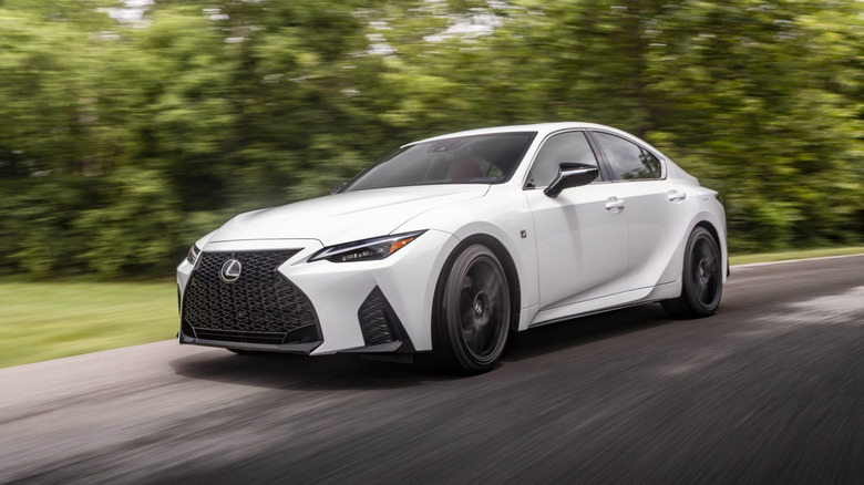 A side on shot of a white 2025 Lexus IS driving
