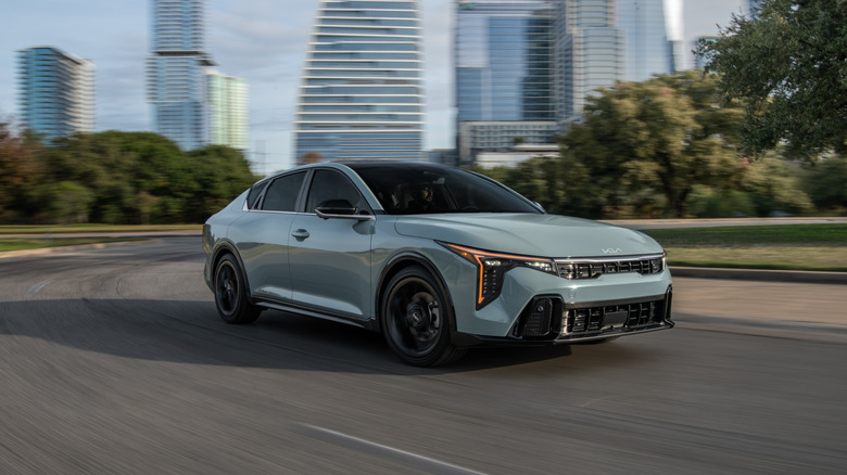 A side on shot of a 2025 Kia K4 driving
