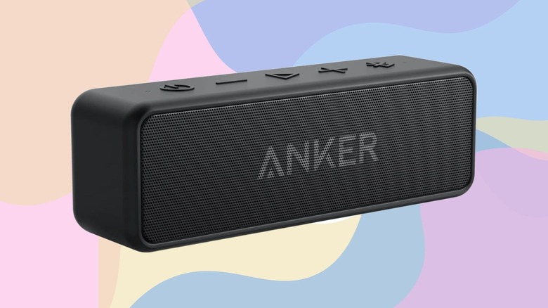 An Anker Soundcore 2 speaker against a pastel multicolor background