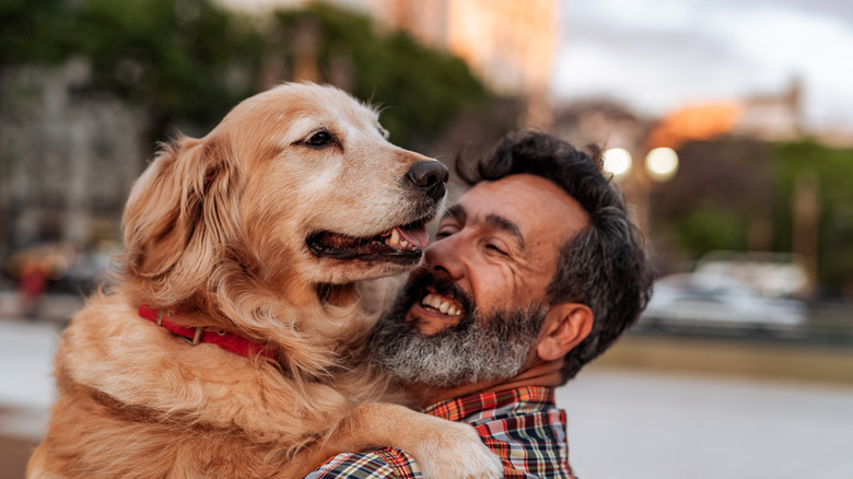 dog and man smiling