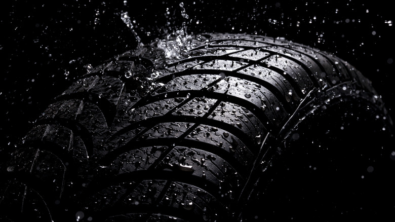 shiny black tire resisting water