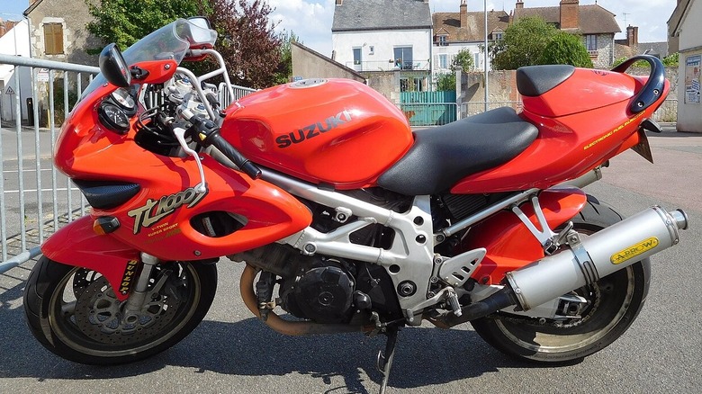 side profile-view of a red Suzuki TL1000S