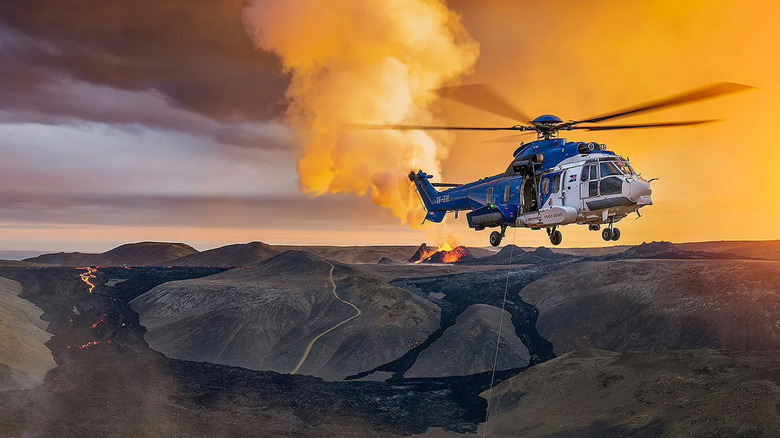 An Airbus H225 performing rescue near an active volcano