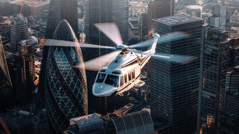 An AgustaWestland AW139 flying through a city