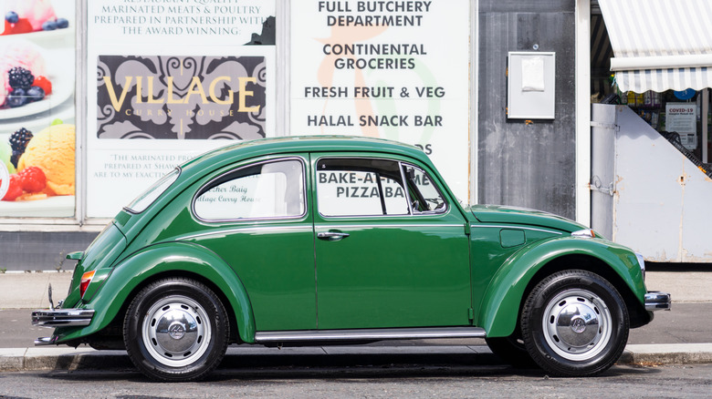 Side view of bright green classic Volkswagen Beetle