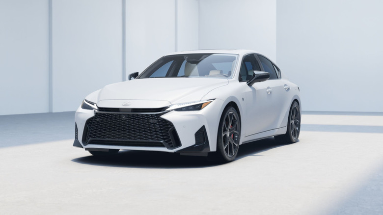 A 2026 Lexus IS 350 in white with modern white and gray background