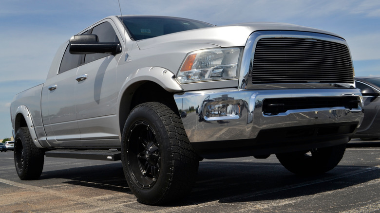 Front 3/4 view of modified silver RAM 2500 pickup truck.