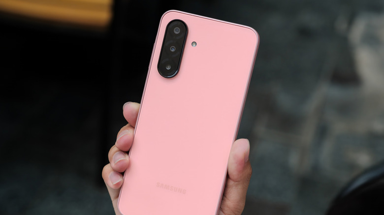 Person holding a budget Samsung smartphone