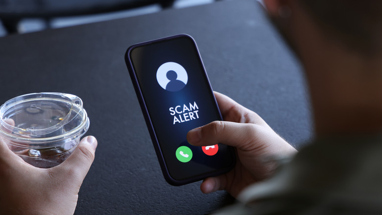 person receiving scam alert phonecall